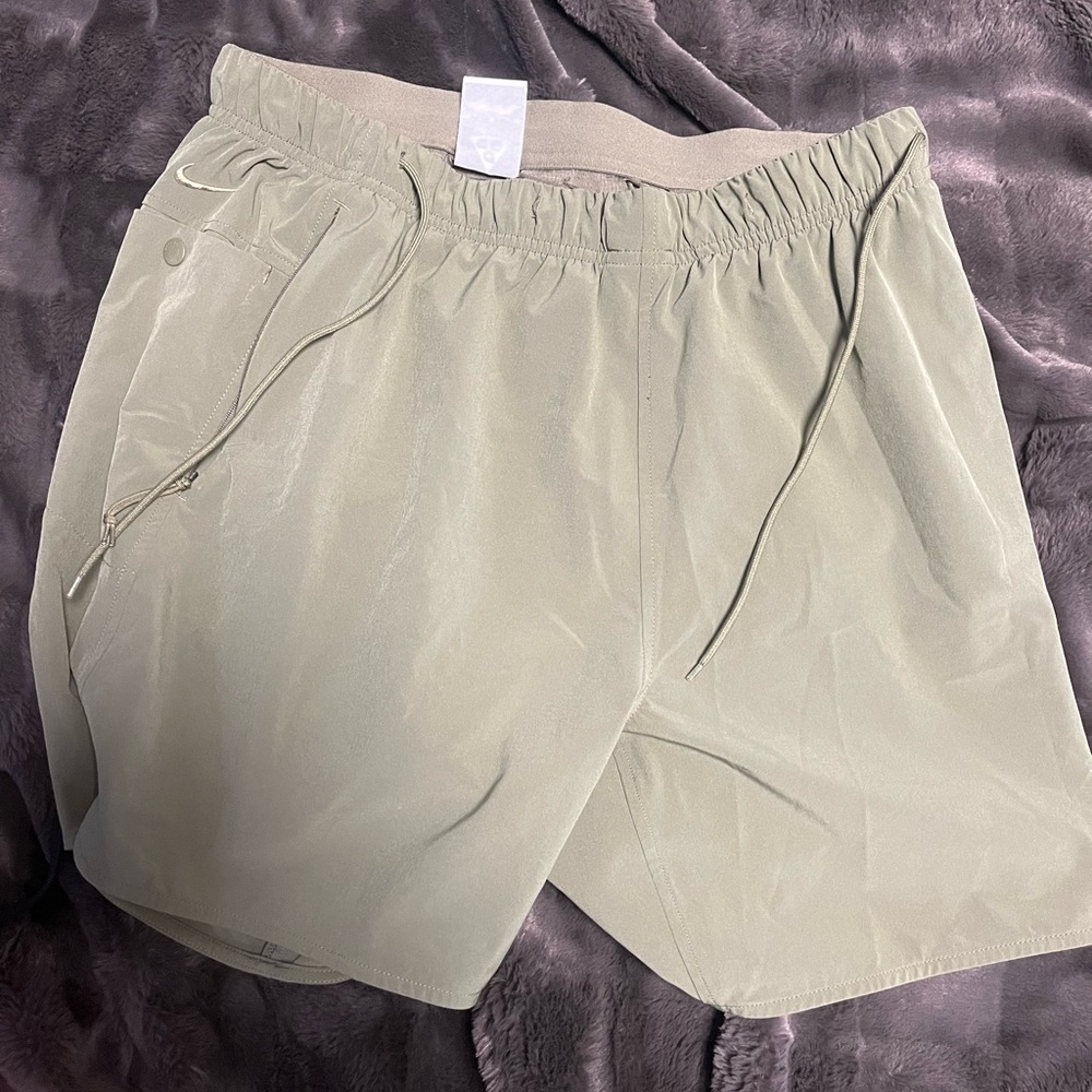 Green Nike shorts and red and black running Nike shorts